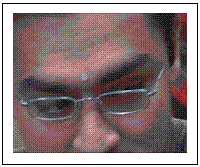 wearing a reflective 'dot' on his forehead