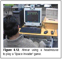 Figure 6.12. Ahmar using a headmouse to play a 'Space Invader' game.